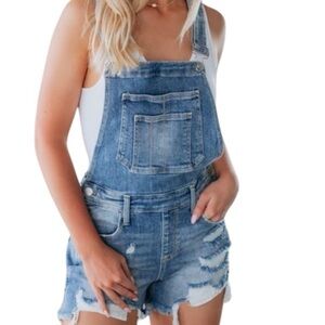 Old Navy Light Blue Denim overall shorts distressed Stock photo slight different